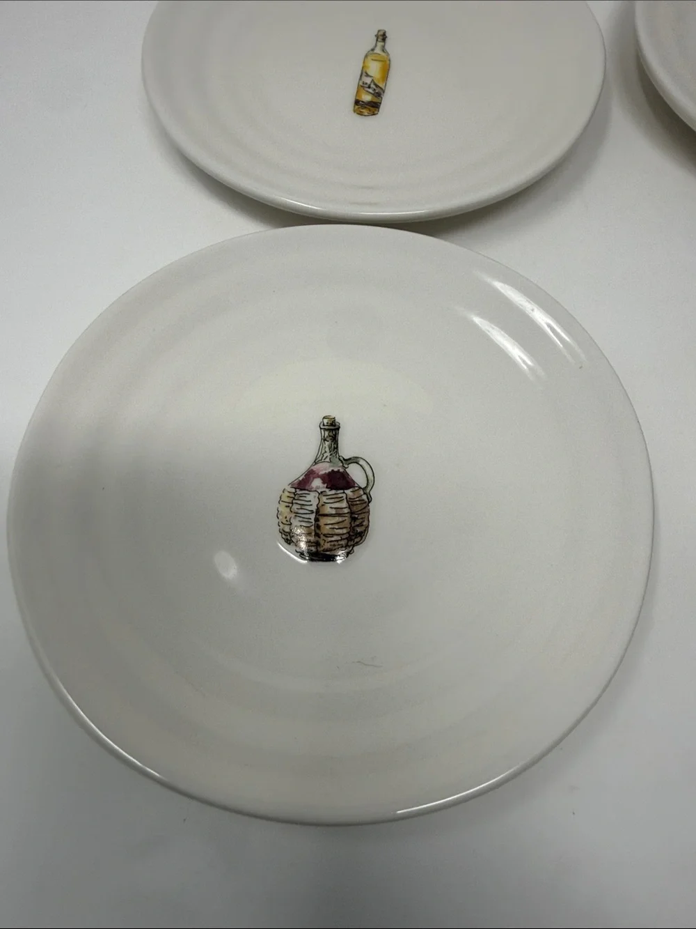 Williams Sonoma Cream Ceramic Dinner Plates with Wine Bottle Motifs - Set of 4